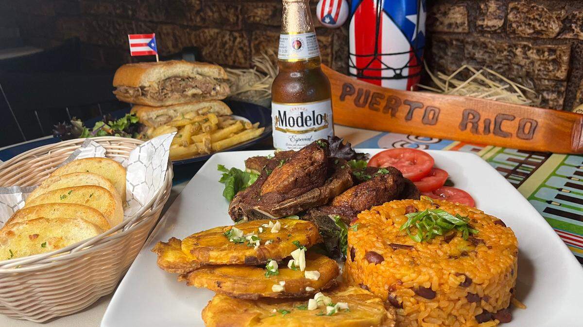 Tostones, fried green plantains, shown above with arroz mamposteao, a rice and bean mixture, is featured at Casa Tinoi.
