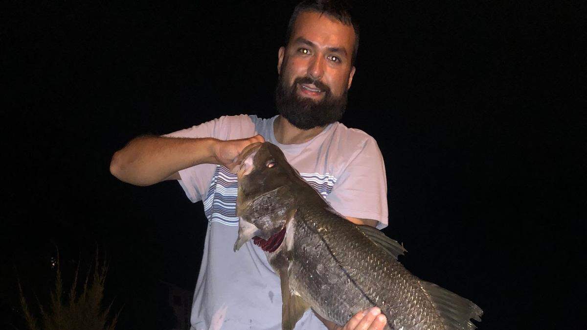 Antonio Lopez holds the 40-inch snook he caught last weekend from Sarasota bridge.