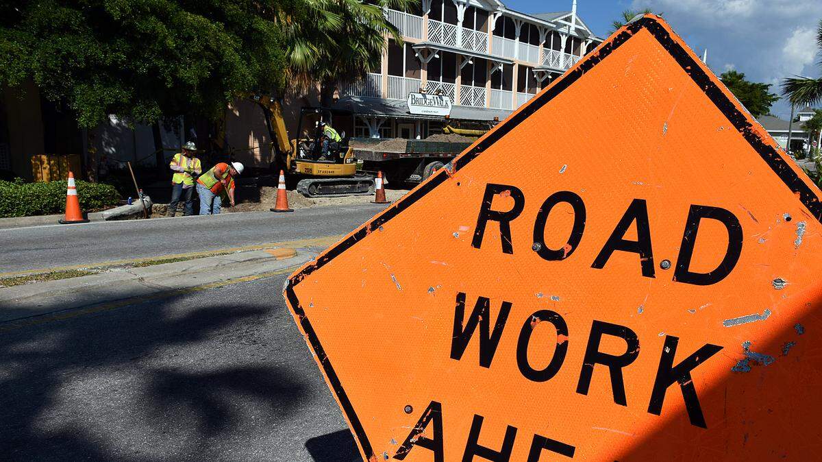 Workers dig up an area of the street along Historic Bridge Street in Bradenton Beach where the road will be closed until December for stormwater work. 
 TIFFANY TOMPKINS-CONDIE/Bradenton Herald