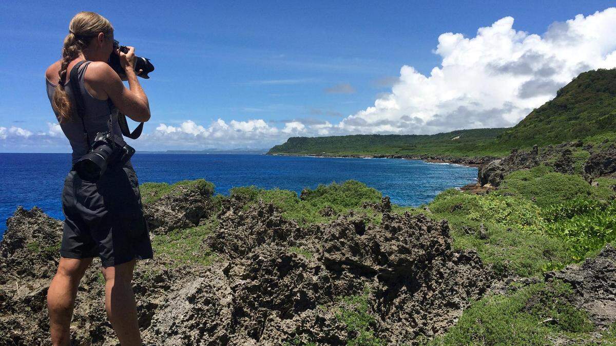Bradenton Herald staff photographer Tiffany Tompkins-Condie shoots pictures of the shoreline in Guam on assignment for a project describing the U.S. military buildup in the Pacific and realignment of forces. 
 ADAM ASHTON/Tacoma News Tribune