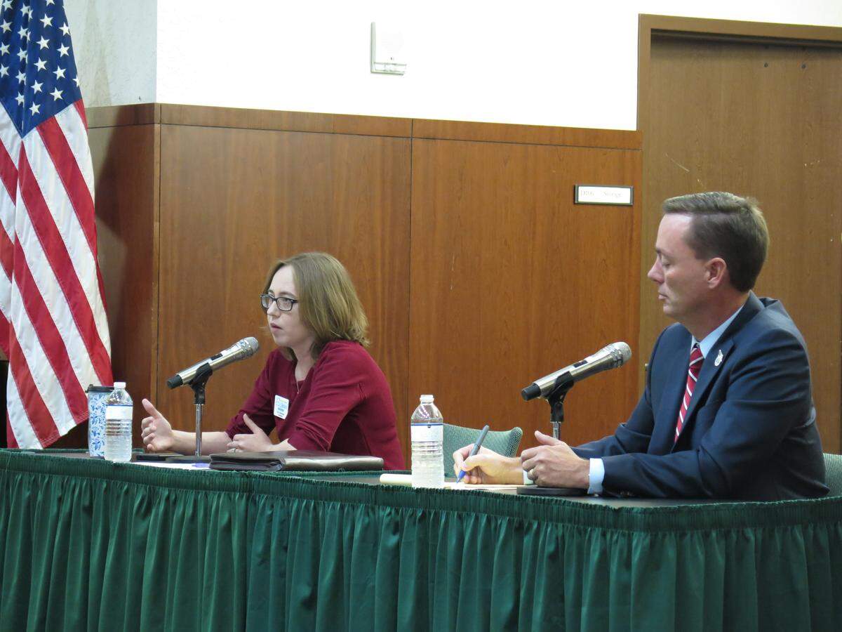 Republican Tommy Gregory (right) takes notes as Liv Coleman, his Democrat opponent for the District 73 State House seat answers a question at the Saturday afternoon candidate forum hosted by USF Sarasota-Manatee.