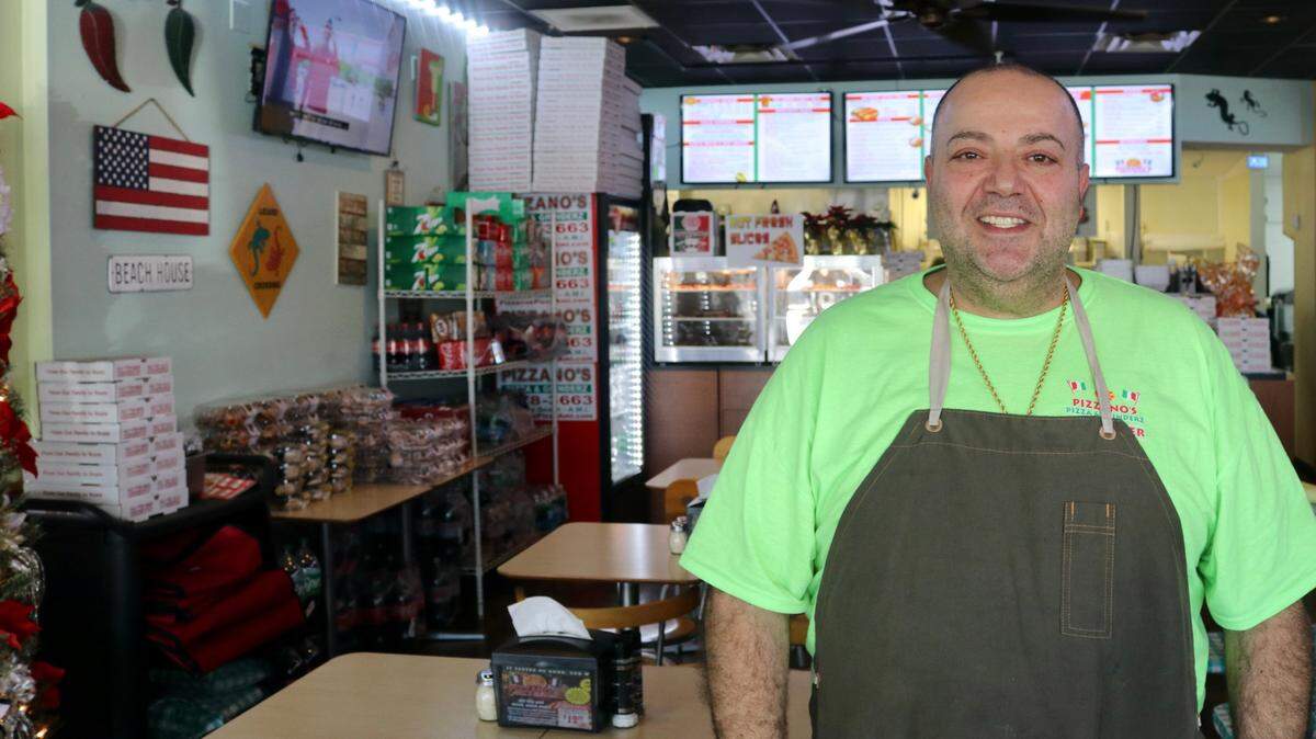 Sam Marhi, shown above Dec. 8, 2022, recently opened Pizzano’s Pizza & Grinderz, with his brother, Tony, at 5318 Marina Drive, Holmes, Beach.