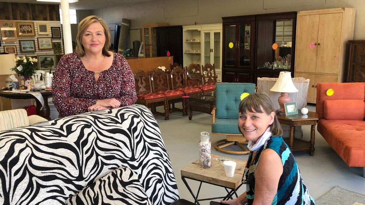 Kim Wilson Dodson, left, and Sheri Ketner are shown in the showroom of Loving Hands Ministries’ new furniture thrift store at 701 Manatee Ave. E., Bradenton.