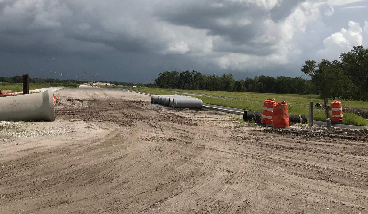 Development is rapidly changing the face of Moccasin Wallow Road. Work is underway, above, on new communities across the street from Neal Land’s proposed Morgan’s Glen mixed-use community.