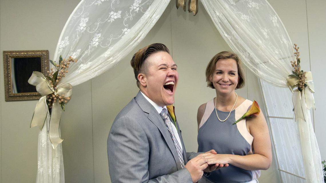 Rebekah Monson, left, and her partner, Andrea Vigil, participate in a wedding ceremony at the marriage license bureau in Miami in January 2015. 
 Wilfredo Lee/Associated Press File