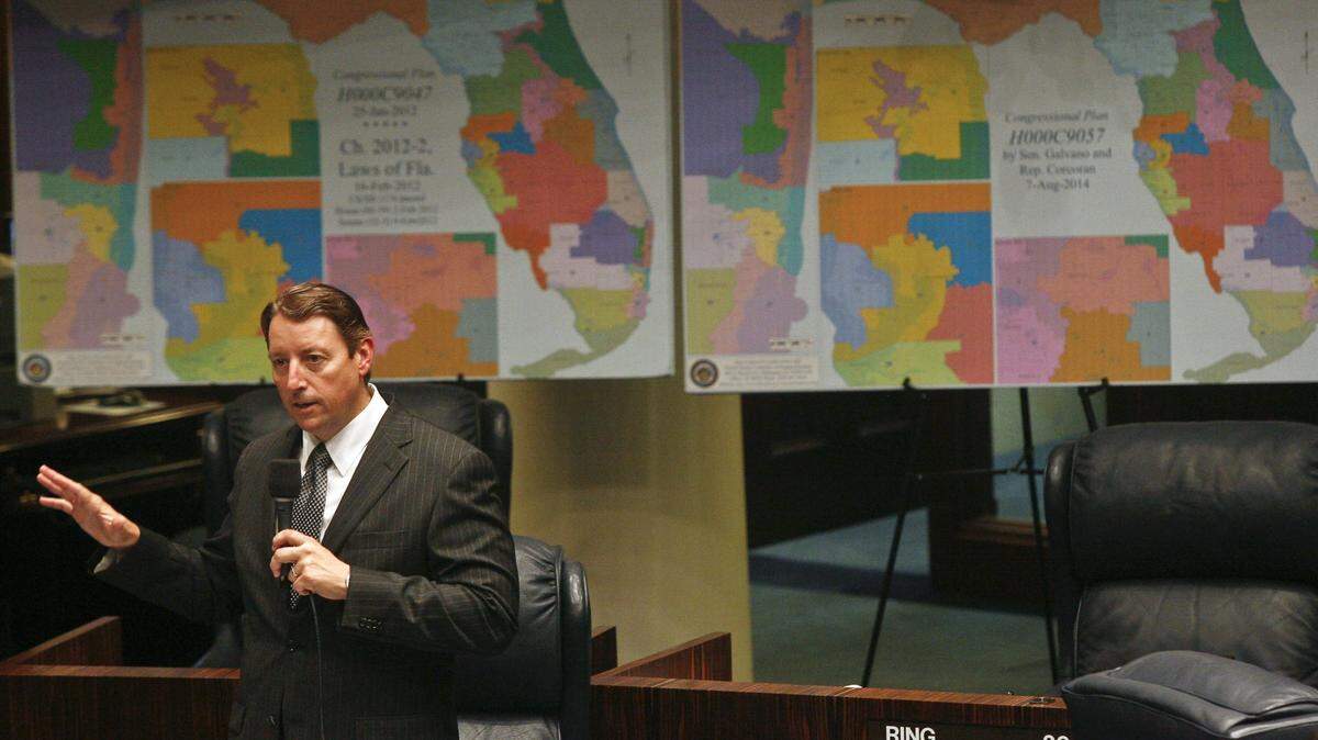 In the last round of redistricting, Senate Reapportionment Chairman Sen. Bill Galvano, R-Bradenton, discusses an amendment on the floor of the Senate in August 2014, at the Capitol in Tallahassee. Behind him are maps of the 2012 Florida congressional districts, left, and the redrawn districts he proposed in Senate Bill 2.