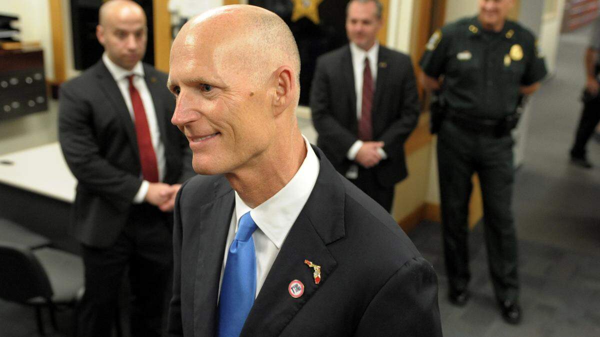 Florida Governor Rick Scott pauses for a brief interview during a visit to the Sarasota County Sheriff's Office on Tuesday in Sarasota. 
 GRANT JEFFERIES/Bradenton Herald