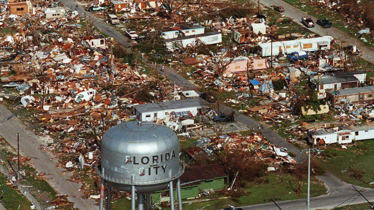 FILE - This Aug. 25, 1992 file photo shows the water tower, a landmark in Florida City, Fla. still standing over the ruins of the Florida coastal community that was hit by the force of Hurricane Andrew. Cities like Tampa, Houston, Jacksonville and Daytona Beach historically get hit with major hurricanes every 20 to 40 years, according to meteorologists. But those same places have now gone at least 70 years, sometimes more than a century, without getting smacked by those monster storms, according to data analyses by an MIT hurricane professor and The Associated Press. (AP Photo, File)