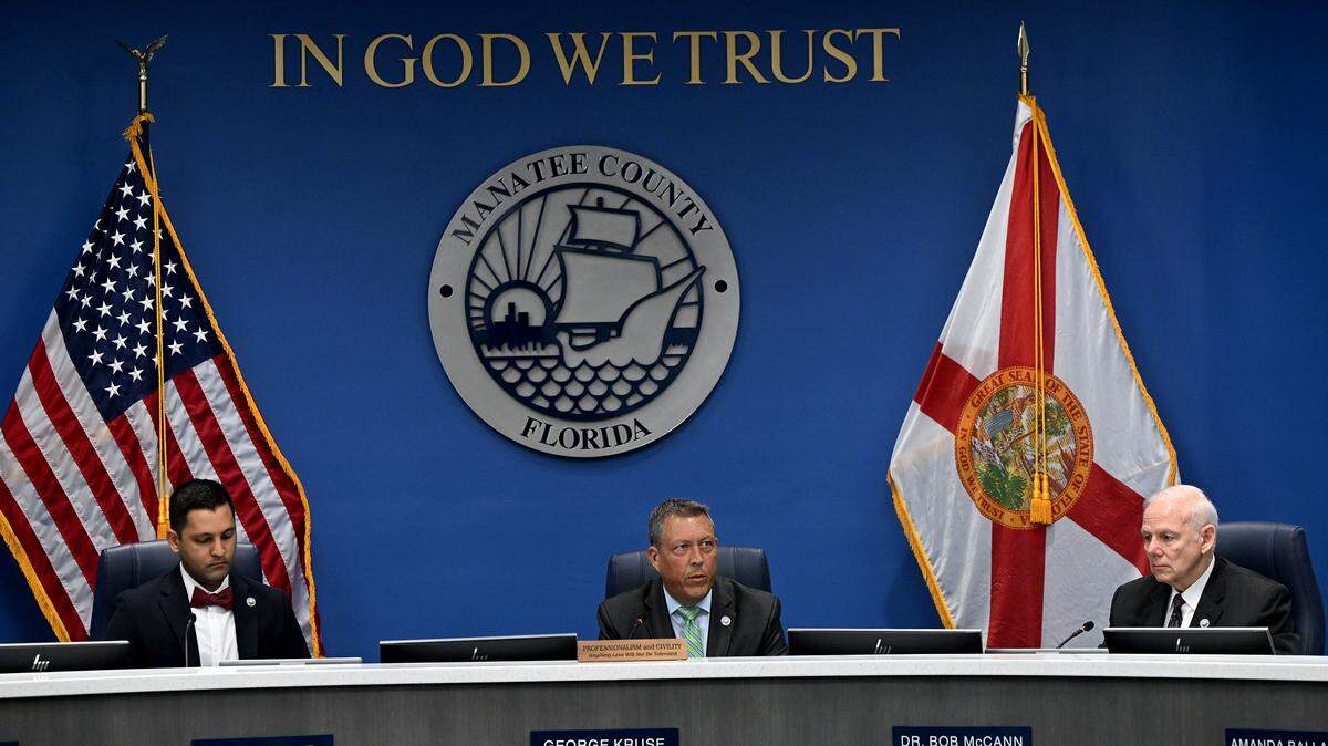 Commissioners Tal Siddique, George Kruse and Bob McCann during a meeting where the Manatee County commissioners approved a motion to direct staff to move forward with crafting an ordinance imposing a curfew on juveniles in unincorporated Manatee County. If approved after public hearings, the curfew would prohibit minors from being in public places or establishments during certain hours of the night.