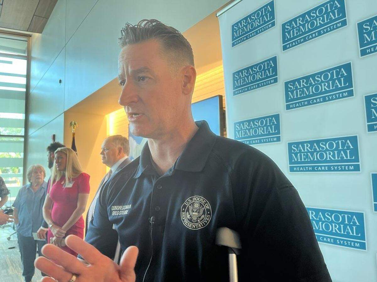 Congressman Greg Steube speaks with the press after making his first appearance since falling 25 feet from a ladder at his home on February 16, 2023.