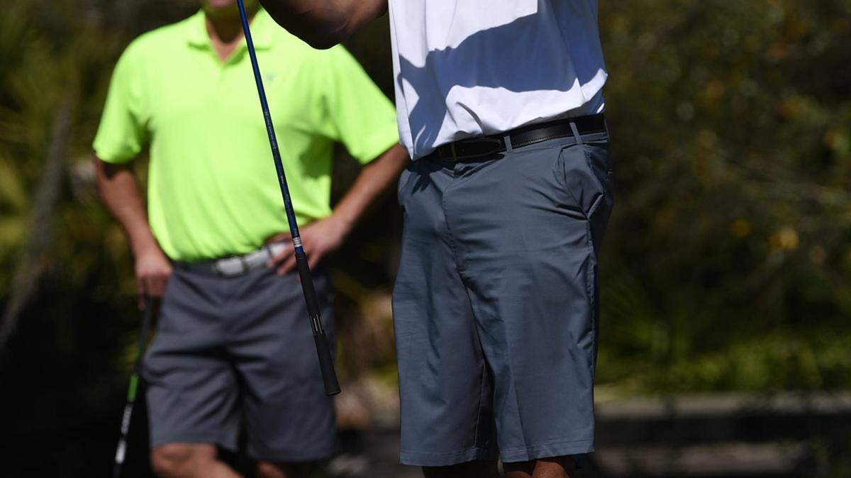 Clark Kellogg reacts after he tees off in the Archie Griffin Celebrity Classic golf tournament at The Concessions Tuesday morning. The event raises funds for the Boys & Girls Club of Sarasota.TIFFANY TOMPKINS/Bradenton Herald