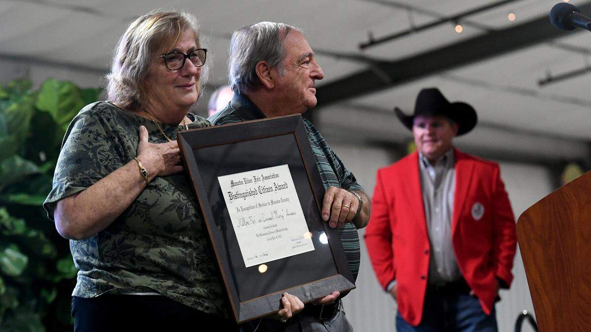Popi and Manny Ameres, founders of Popi’s restaurants in Bradenton-Sarasota area, on the stage as they are recognized as Manatee County Fair’s distinguished citizens on Jan. 5, 2023.