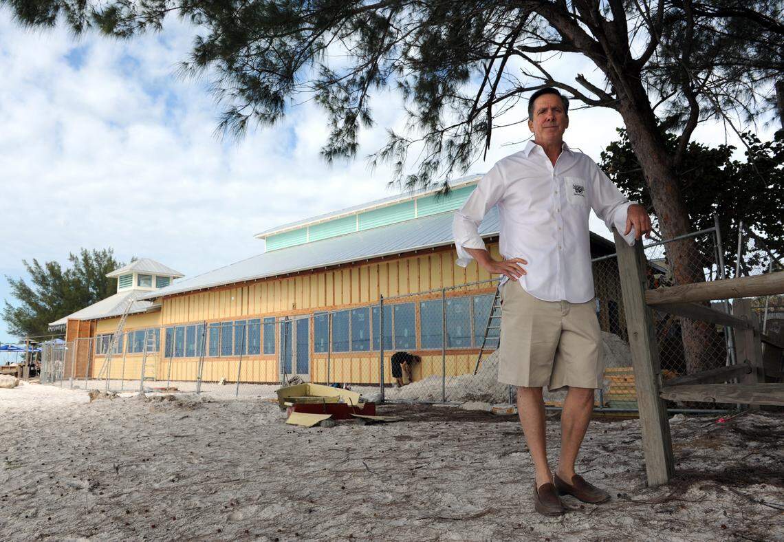 Ed Chiles stands on the beach by his restaurant, the Sandbar, which was undergoing extensive renovations to the dining room in 2013.