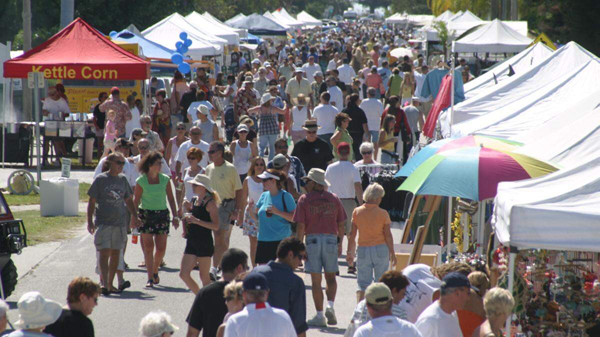 The crowd walks along Pine Avenue during a past Bayfest on Anna Maria Island. HERALD FILE PHOTO