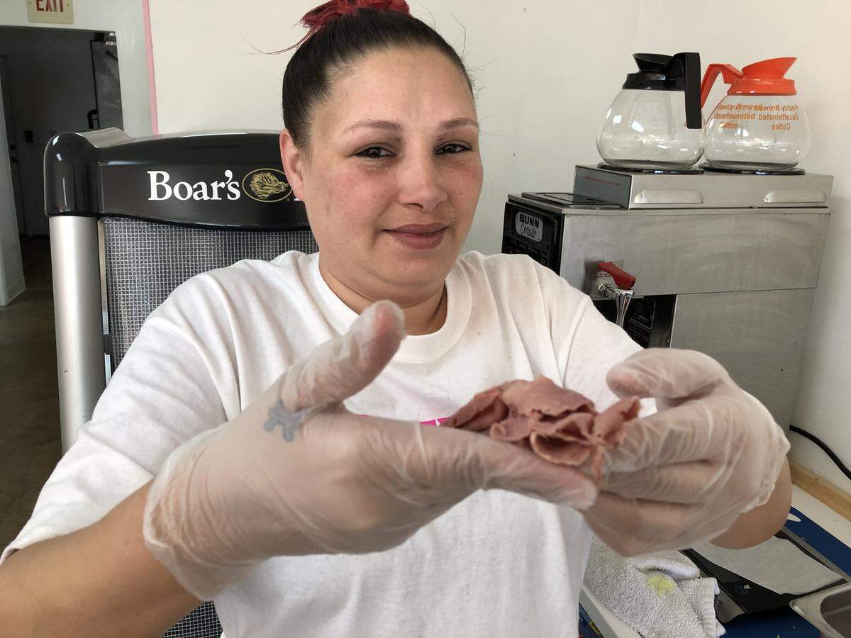Kim Gomez slices the roastbeef very thin at Jersey Girl Subs, which opened recently at 7832 Cortez Road W. in the Coral Way Plaza.