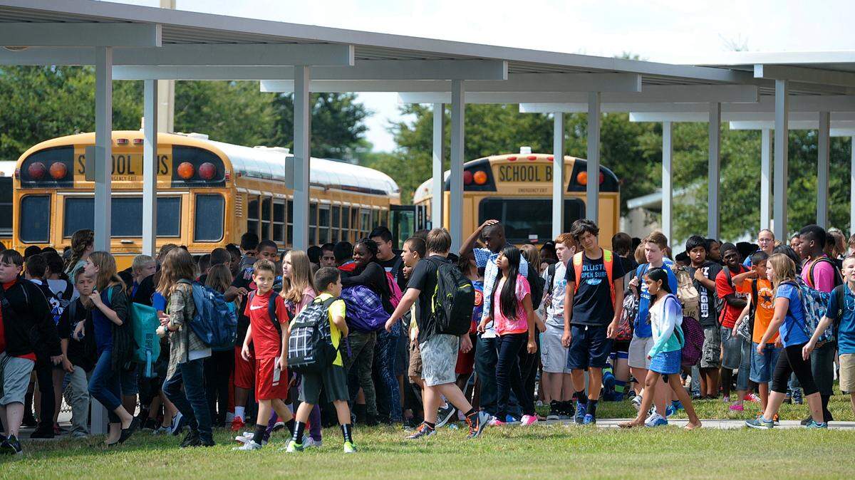 Buffalo Middle School students makes their way to the school bus loading zone at the end of the school day in this file photo.