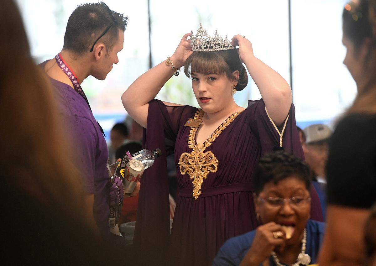 A De Soto Parade participant straightens her crown as some found shelter in the Manatee High cafeteria while a rain band made its way through the area. Parade organizer still plan to have the parade, just delaying the start until 7:45.