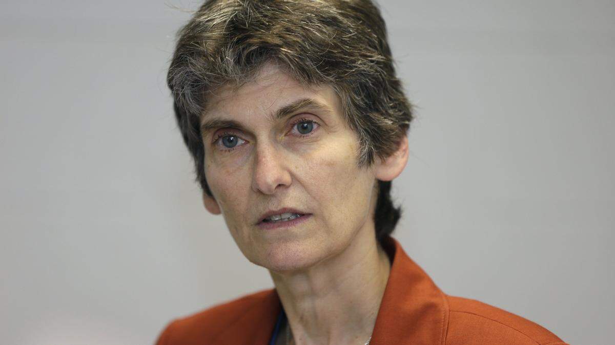 Janet McCabe, acting assistant Environmental Protection Agency administrator for air quality, addresses the media at a dedication ceremony for a new heavy-duty truck testing lab, Tuesday, Oct. 13, 2015 in Ann Arbor, Mich. McCabe wouldn't say if Volkswagen's failure to disclose the defeat device software in its 2016 application for emissions certification was illegal. "I don't want to speak to any potential subjects of an enforcement activity," she said. (AP Photo/Carlos Osorio)