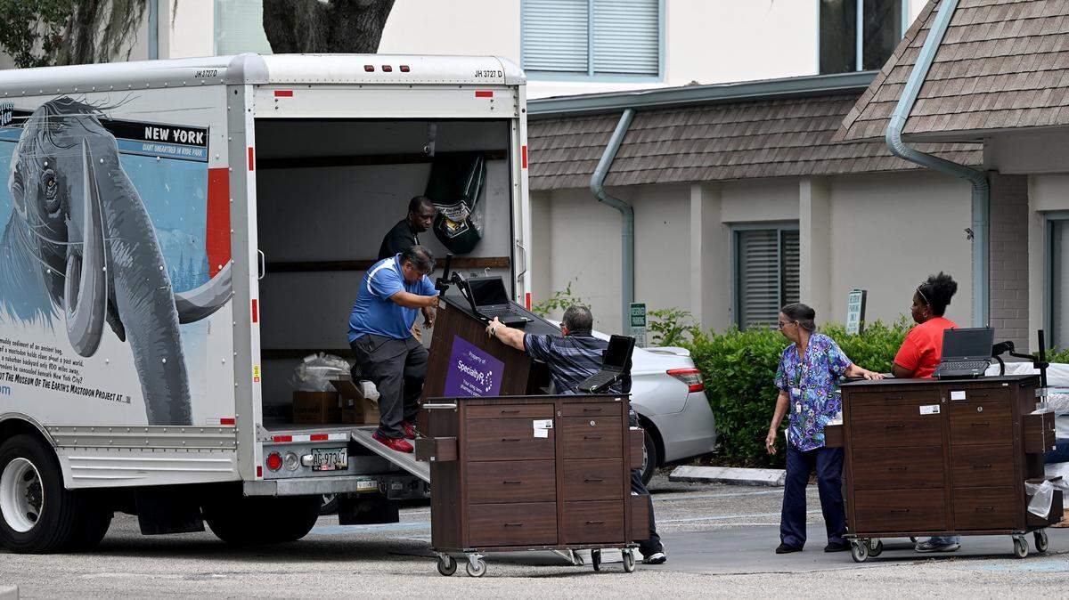 Employees of Aspire at Bradenton move equipment into a truck while evacuating residents from the nursing home as Hurricane Helene approaches Manatee County on Wednesday, Sept. 25, 2024.