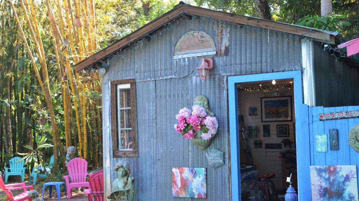 Mango’s Art is a shed-turned-art-gallery in Village of the Arts featuring the works of painter and multimedia artist Cheryl Miller.