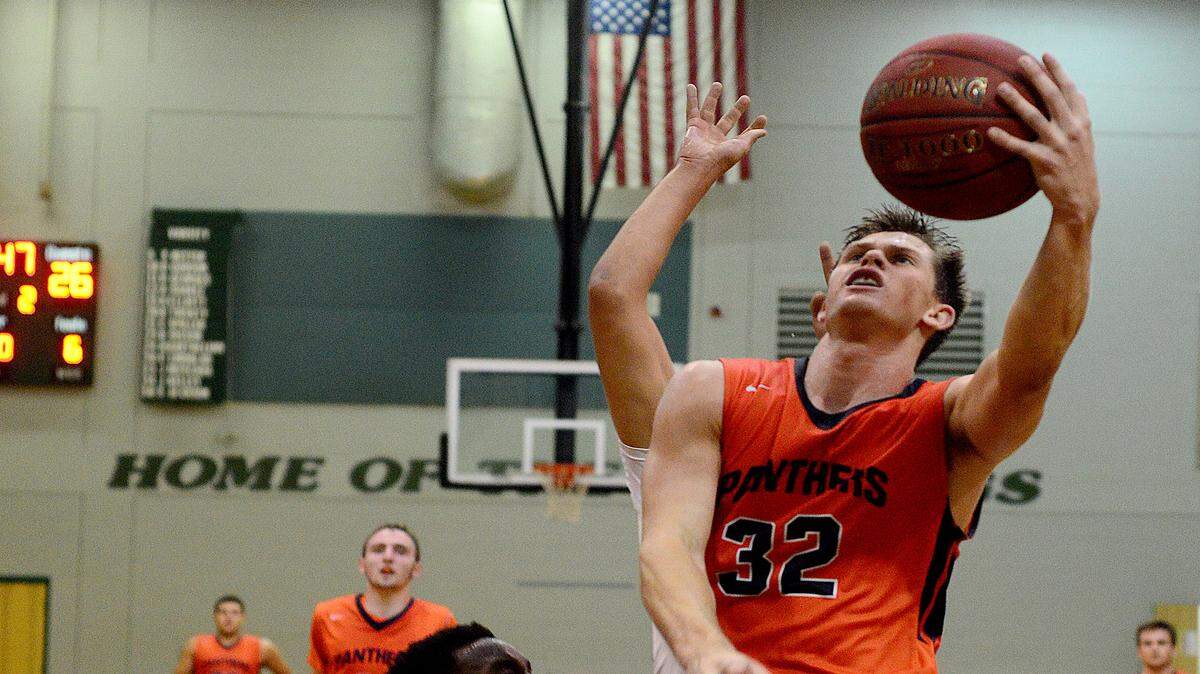 Ryan Leunk (32) scores two of his game-high 26 points on a fast break Tuesday. The Lakewood Ranch Mustangs came back from a 19-point deficit to force overtime before the Bradenton Christian Panthers won 88-80 at Lakewood Ranch High School. 
 DAVID W DOONAN | Special To The Herald