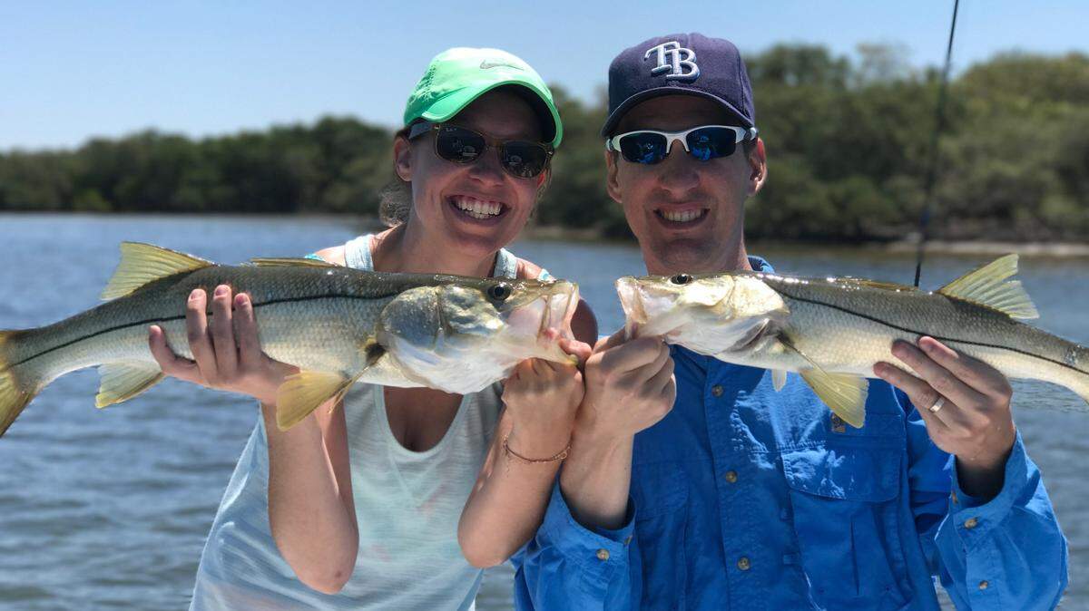 Cory and Liz Lashway with a pair of snook caught fishing Tampa Bay.