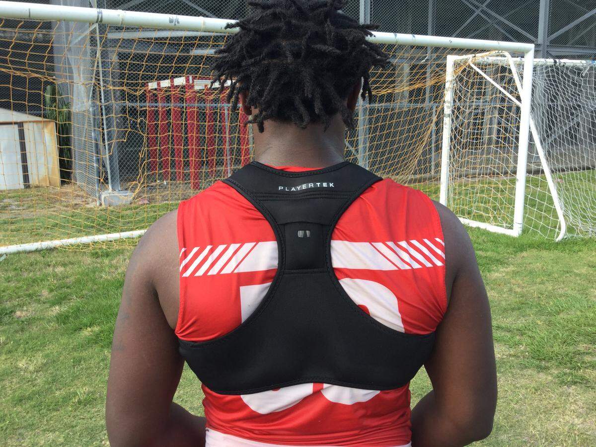 Manatee High's Justin Porter wears the PlayerTek by Catapult GPS tracking system. From the back, the GPS device detaches, and tracking player movement and energy output are analyzed through a computer or phone application for optimal athletic performance.