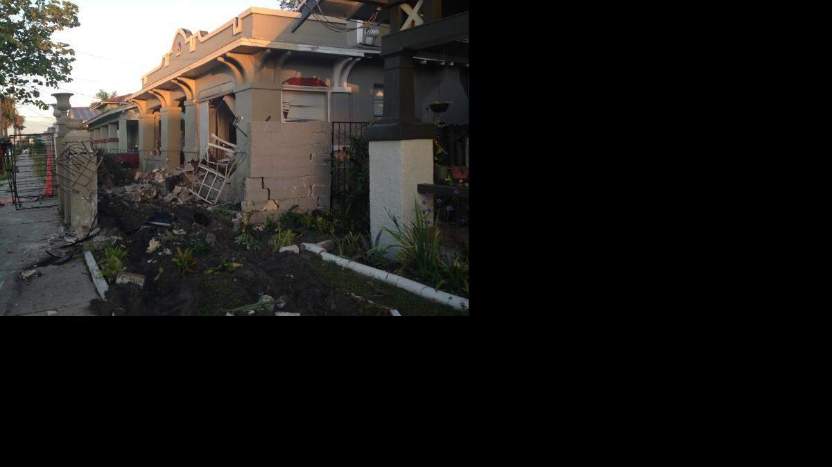 Two people in a sedan died late Wednesday when their car slammed into a house on Main Street in Tampa. (Fallon Silcox, staff)