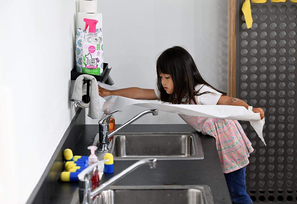 Mina Hirooka, 3, washes up after playing at the Soar Lab, which recently opened in Manatee County's Sara Scott Harllee Center. They provide families with hands-on learning experiences that are tied to early development learning standards shown on Friday, Oct. 17, 2025.