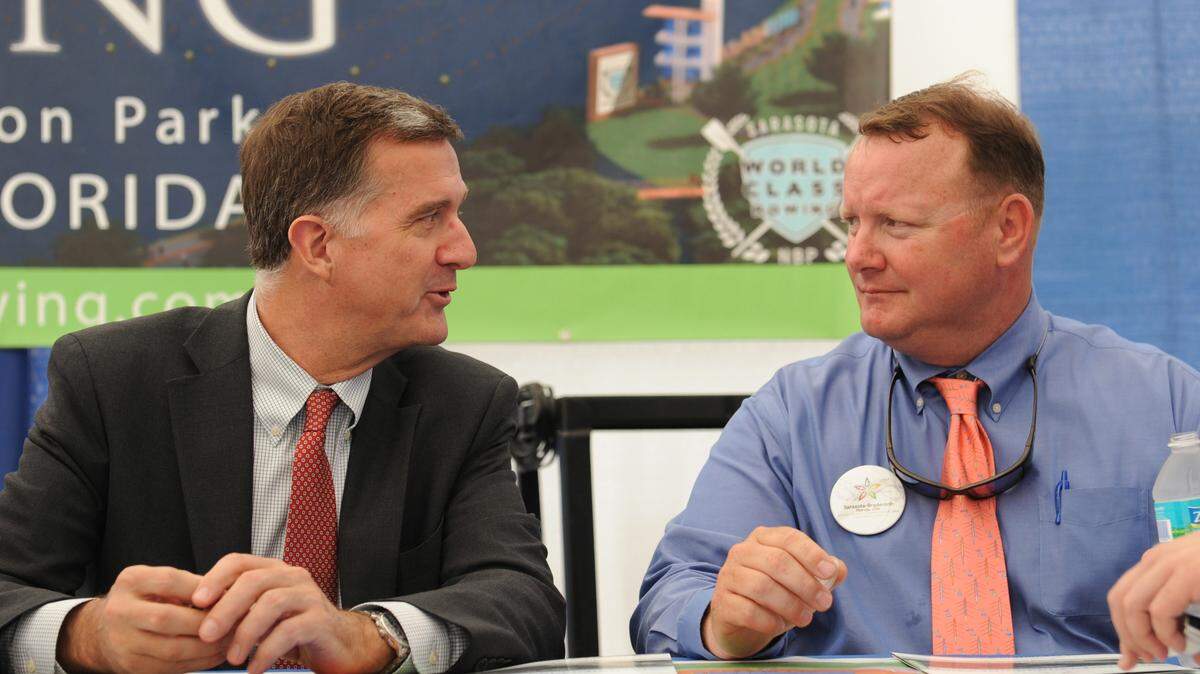 Matt Smith, representing the International Federation of Rowing Associations, talks with Paul Blackketter, president of the Suncoast Aquatic Nature Center, during a tour of Nathan Benderson Park on Tuesday as the IFRA considers a Manatee-Sarasota bid to host the 2017 World Rowing Championships. 
 GRANT JEFFERIES/Bradenton Herald