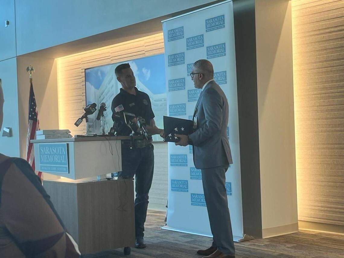 Congressman Greg Steube presents Dr. Ali Al-Rawi, the Sarasota Memorial Trauma Medical Director, with a flag flown over the Capitol on February 16, 2023.