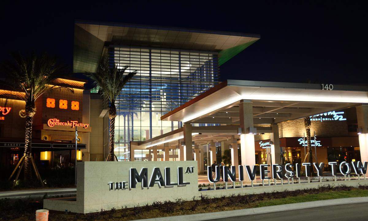 Lights illuminate the tower and main entrance of The Mall at University Town Center at night. Sales tax revenues from the Mall at University Town Center have been erroneously paid to Manatee County, the Florida Department of Revenue has advised.  Those revenues should have gone to Sarasota County.