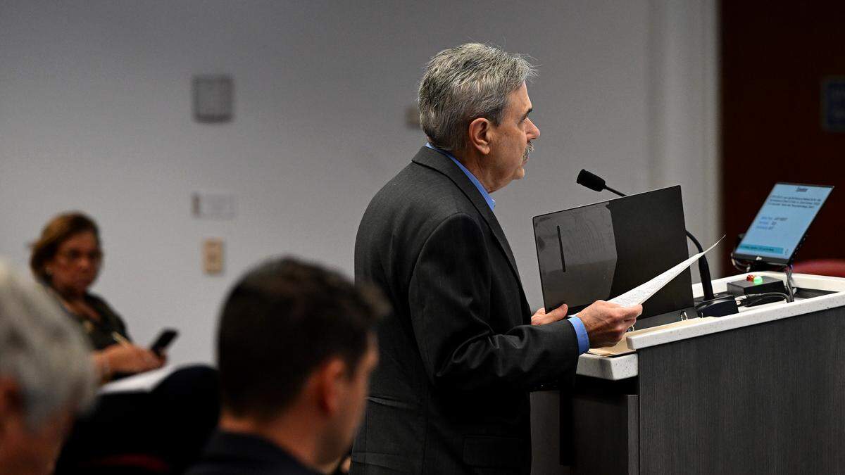 Gary Hebert presents a petition against rezoning during a meeting for Linger Lodge rezone and preliminary site plan on Tuesday, Sept. 7, 2023.