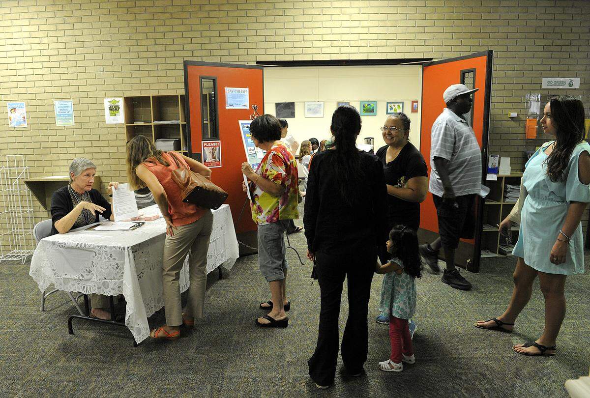 Job applicants line up at Bradenton Central Library’s Hiring Fair in 2014. The hiring fair returns Monday and it will be larger than ever.