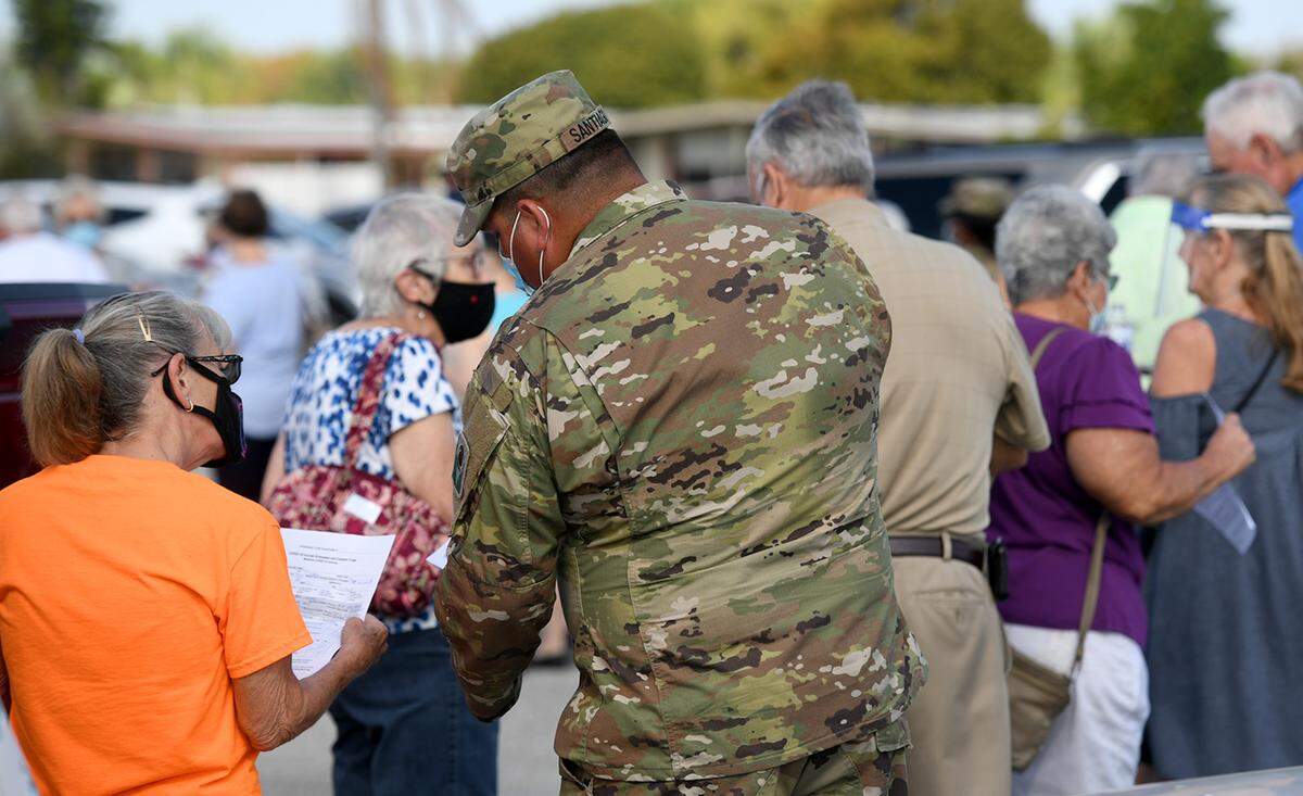 03/02/21--People 65 and over at Colony Cove in Ellenton to make appointments and get vaccinated against COVID-19.