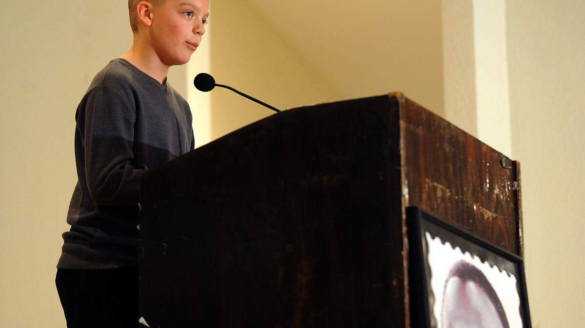 Sully Maley of Nolan Middle School, presents his winning essay for middle schoolers Thursday night at the Palmetto Youth Center during the Martin Luther King Jr. Essay and Speech competition.TIFFANY TOMPKINS-CONDIE/Bradenton Herald