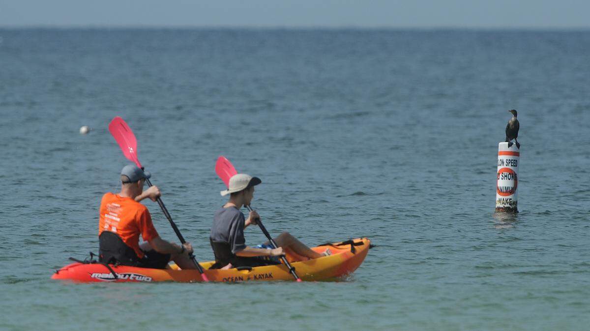 Beautiful day to enjoy the sunshine and GulfTwo men paddle in the Gulf of Mexico as they enjoy a day in the sun and pleasant temperatures Friday on Holmes Beach. Saturday will be just as nice, according to weather.com. There is little chance of rain, mostly sunny and high in upper 80s.GRANT JEFFERIES/Bradenton Herald