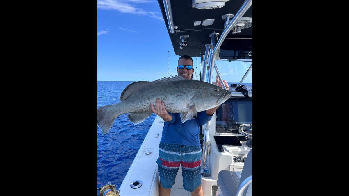 Jon Chapman poses with an American red snapper caught on the first day of the season while fishing in 200 feet of water in the Gulf of America.