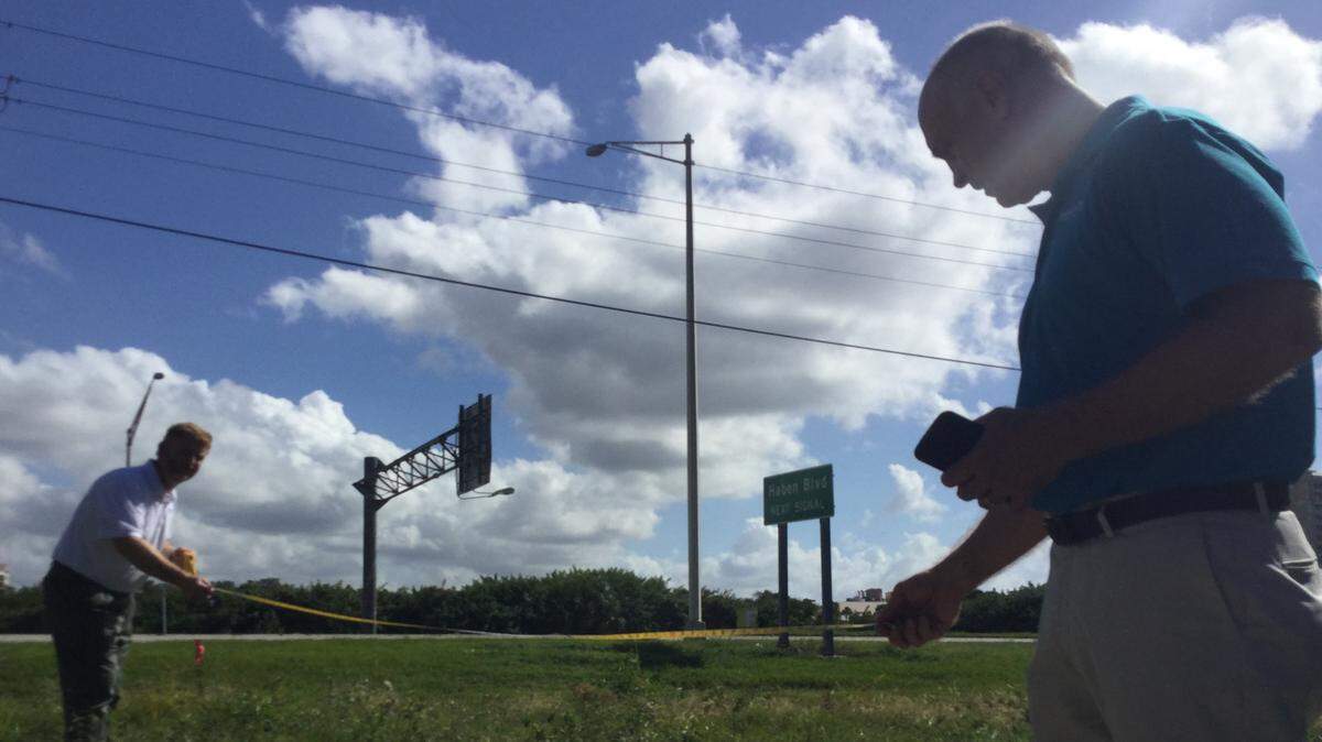 Impact Local Florida managing partners Chris Burns and Gregg Anderson take measurements at a site where a 35-foot wide new electronic billboard will rise into the sky near Estuary Park in Palmetto after officials approved a conditional use permit. The sign will be used for advertising, which could generate thousands of dollars in new revenue for the city, as well as for city events and emergency declarations. MARK YOUNG/Bradenton Herald