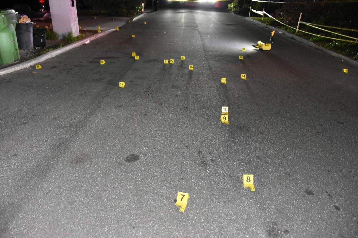 Yellow evidence markers at the scene of shooting where three people were shot on Monday, Jan. 23, 2023 in the 100 block of 10th Ave. West in Bradenton.