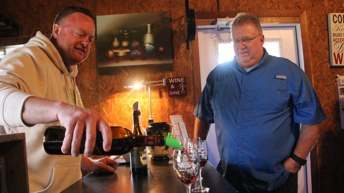 Erik Hall, owner and vintner of Fiorelli Winery, pours a sample during a wine tasting. The business is located at 4250 County Road 675 E.