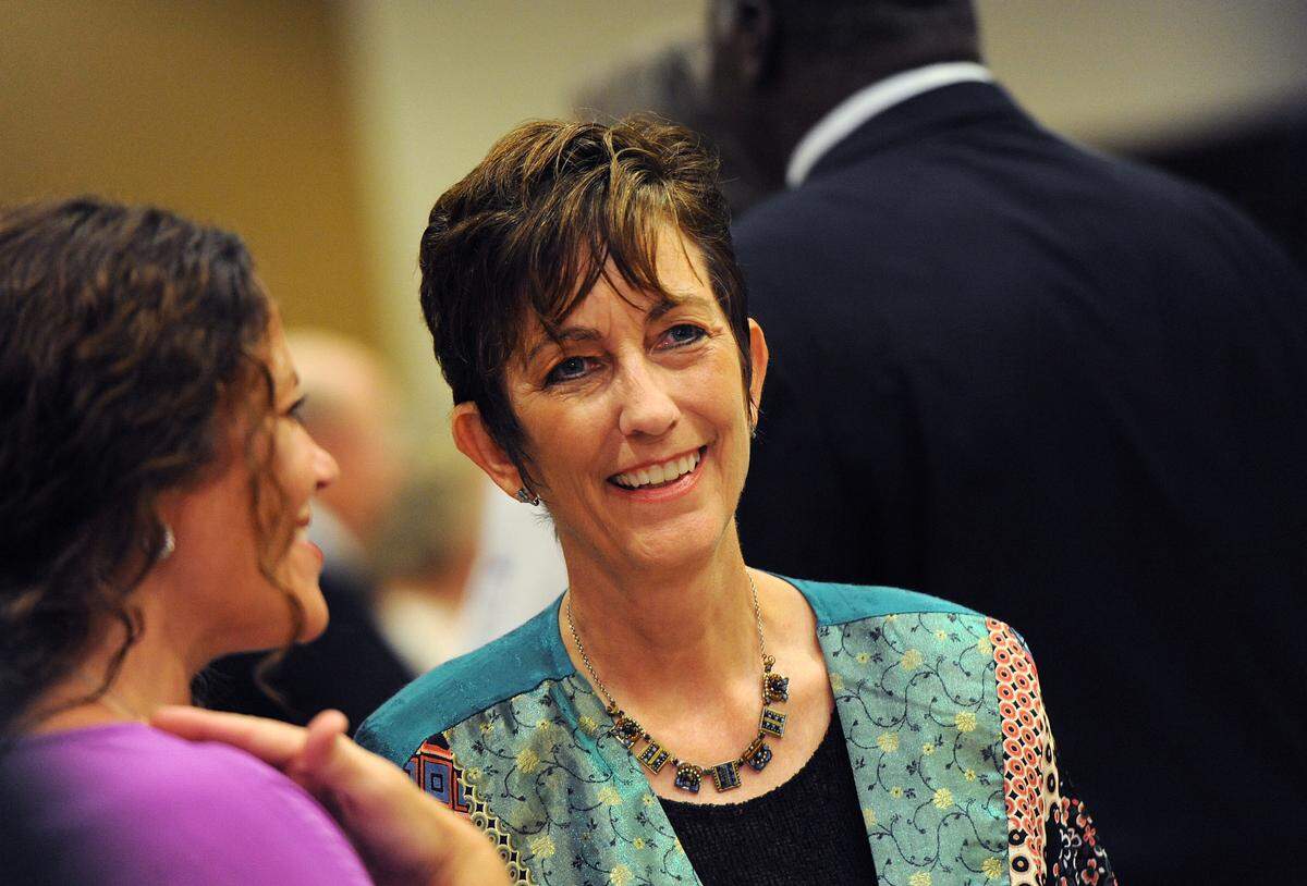 Johnette Isham laughs with friends at the Manatee Players Inaugural Crystal Gala at the Manatee Performing Arts Center 8/3/2013. TIFFANY TOMPKINS-CONDIE/Bradenton Herald