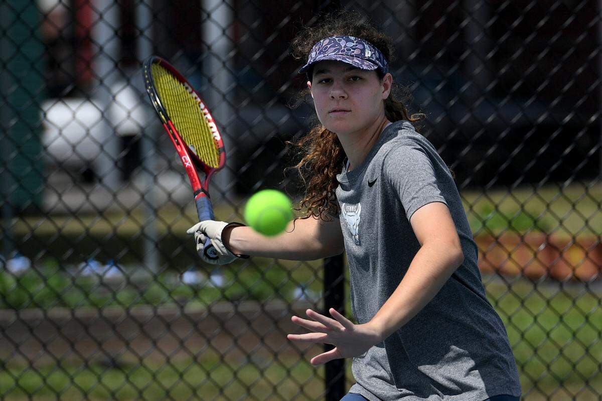 Odessa Eisch, 18, is a top tennis player at the Parrish Community School going to compete at states.