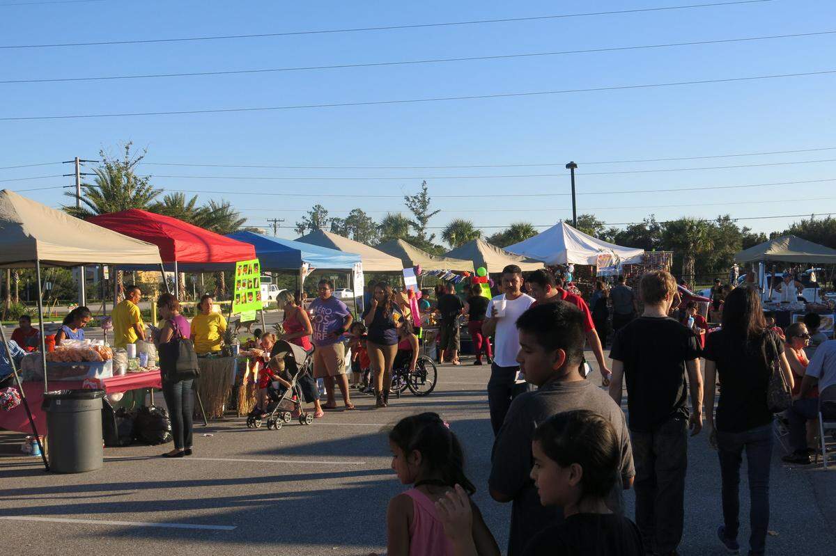 Families enjoy the variety of vendors at the 15th Annual Multicultural Festival hosted by the Farmworker Career Development Program at Manatee Techical Institute.