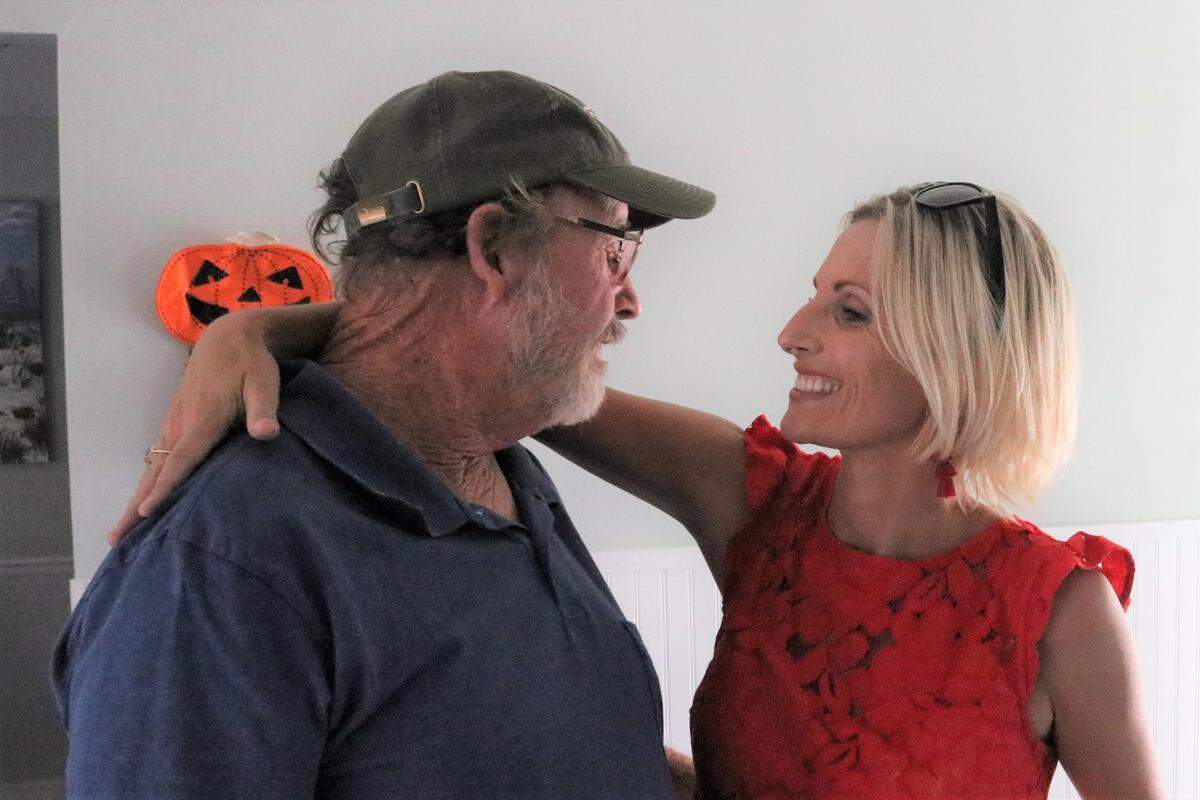 Katie Guth congratulates her dad, Scott Moore, on his selection to the Manatee County Agricultural Hall of Fame.