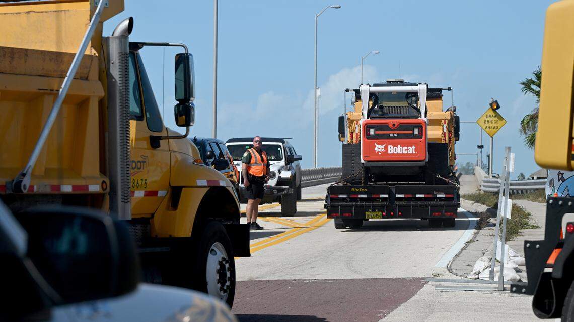 Heavy equipment passes a roadblock at the Cortez Bridge to Anna Maria Island in the aftermath of Hurricane Helene in Manatee County on Friday, Sept. 27, 2024.