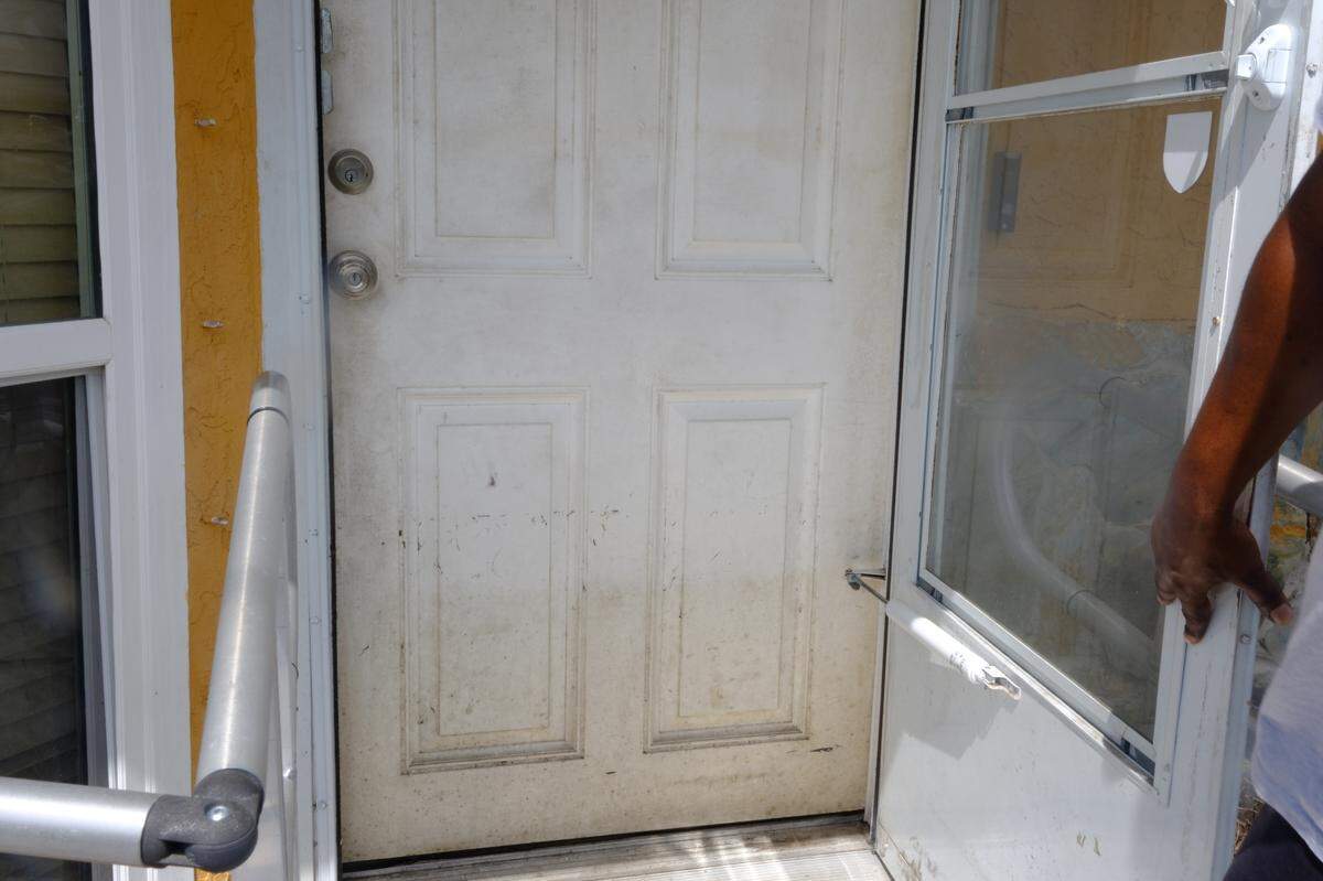 The front door of a home in Rubonia is left with an imprint of storm surge after Hurricane Helene flooded the neighborhood.