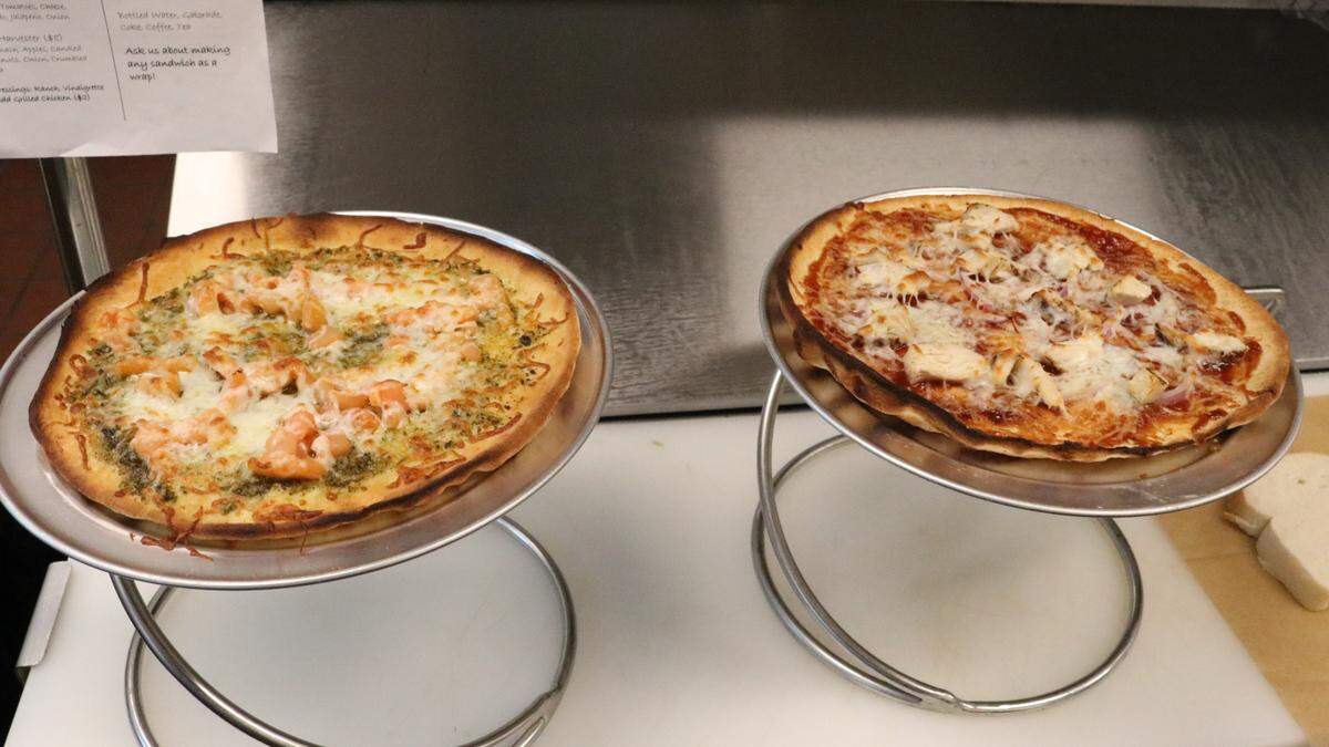 Rhianna Walters has opened the Basic ‘Wiches deli in unit 130 of 119 Bridge Street, Bradenton Beach. Shown above are two of her freshly made flatbreads, barbecue chicken and capretta.