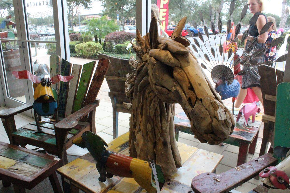 The new Sarasota Architectural Salvage store in Manatee County is packed with unique, sustainably produced decor items, including this wooden horse from Bali.