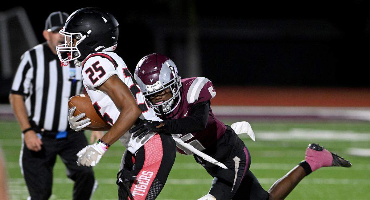 Palmetto’s Simeon Matt is pushed off field by Riverview during the FHSAA playoff game in Sarasota Friday, Nov. 10.